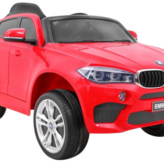 BMW X6M Elektrické dětské auto červené + dálkové ovládání + EVA + pomalý start + audio panel + LED dioda