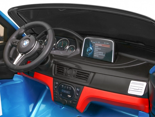 BMW X6M XXL pro 2 děti Modrá barva + Pilot + Eco kůže + Bezpečnostní pásy + Pomalý start + MP3 + LED