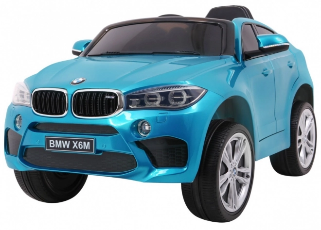 BMW X6M Elektrické dětské auto Modrá barva + dálkové ovládání + EVA + pomalý start + audio + LED dioda