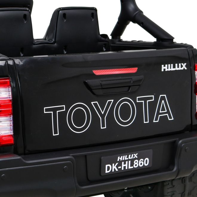 Toyota Hilux baterie pro děti černá + pohon 4x4 + dálkové ovládání + 2 nosiče zavazadel + rádio MP3 + LED dioda