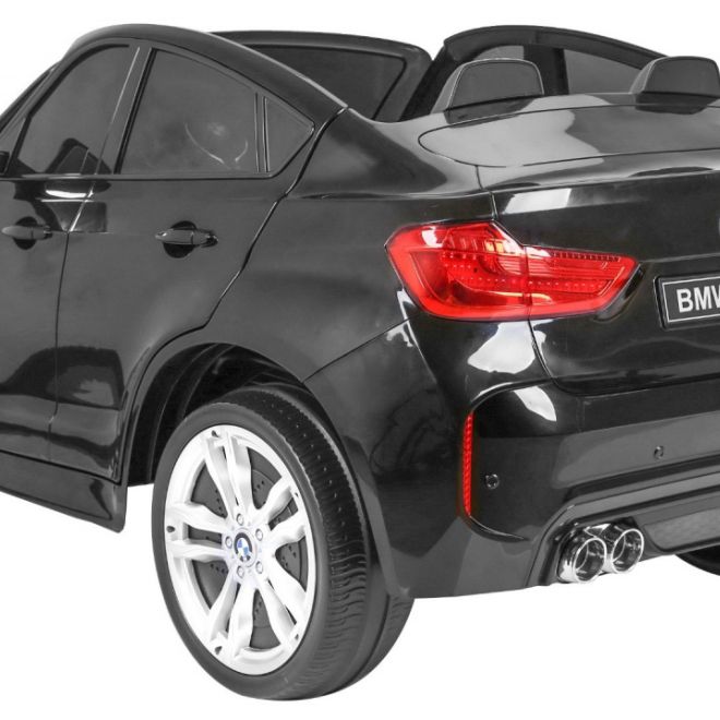 BMW X6M XXL pro 2 děti Černá + Dálkové ovládání + Eko kůže + Bezpečnostní pásy + Pomalý rozjezd + MP3 USB + LED dioda
