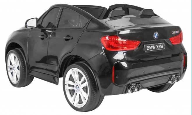 BMW X6M XXL pro 2 děti Černá + Dálkové ovládání + Eko kůže + Bezpečnostní pásy + Pomalý rozjezd + MP3 USB + LED dioda