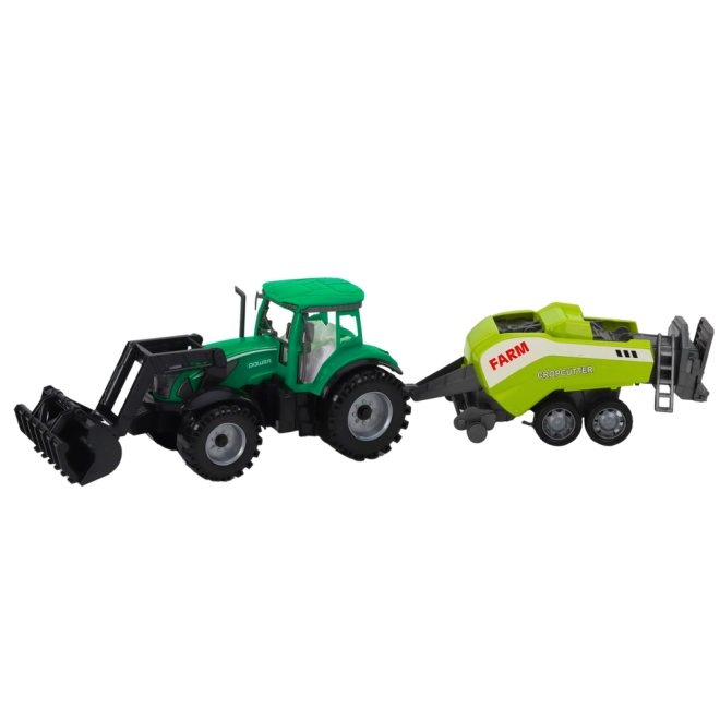 Zelený traktor s nakladačem a kompatibilním lisem na balíky
