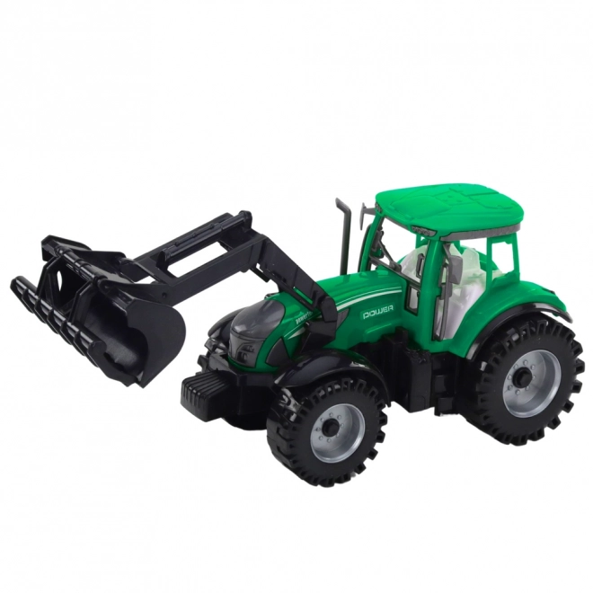 Zelený traktor s nakladačem a kompatibilním lisem na balíky