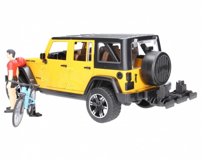 Bruder Jeep Wrangler Rubicon s cyklistou a kolem