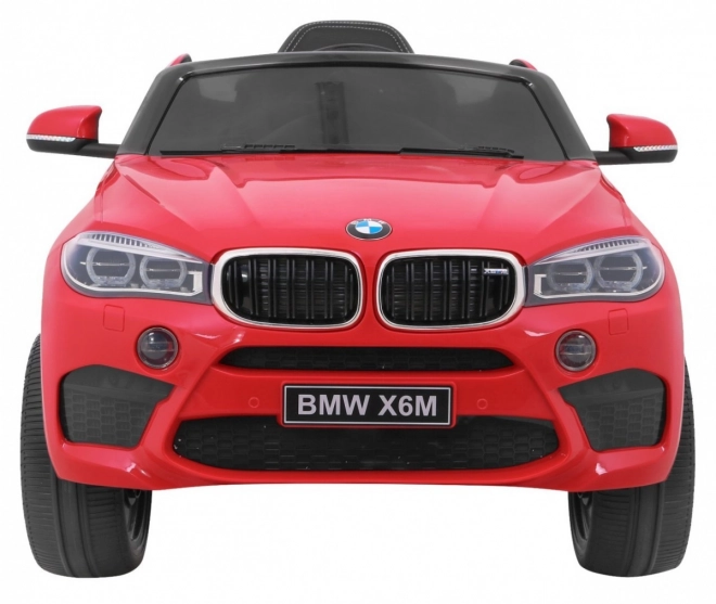 BMW X6M Elektrické dětské auto červené + dálkové ovládání + EVA + pomalý start + audio panel + LED dioda