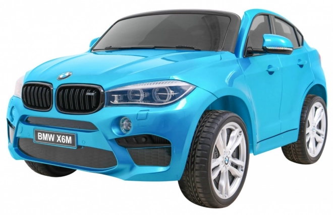 BMW X6M XXL pro 2 děti Modrá barva + Pilot + Eco kůže + Bezpečnostní pásy + Pomalý start + MP3 + LED