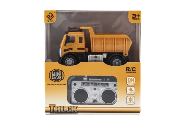 Auto RC nákladní sklápěčka plast 12cm 27MHz na dálk.ovl. na baterie se světlem v krab. 16x18x8cm