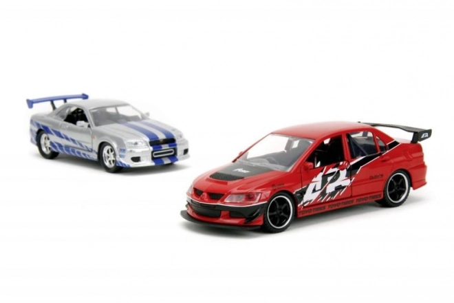 Rychle a zběsile Twin Pack 2006 Mitsubishi Lancer Evo IX + Brianův 2002 Nissan Skyline GTR R34, 1:32 Wave 4/2