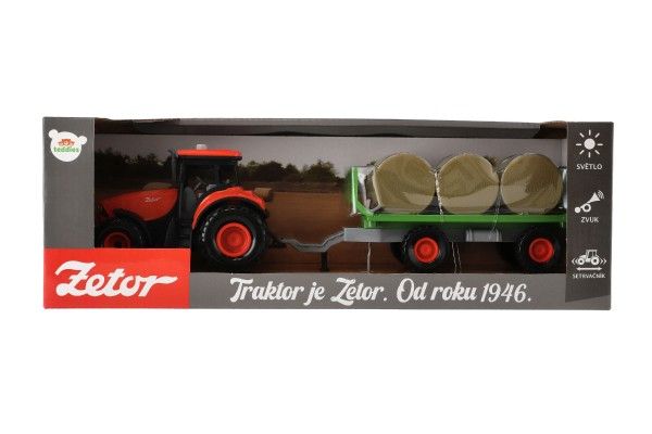 Traktor Zetor s vlekem a balíky plast 36cm na setrvačník na bat. se světlem se zvukem v krab. 39x13