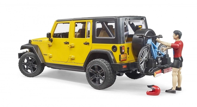 Bruder Jeep Wrangler Rubicon s cyklistou a kolem