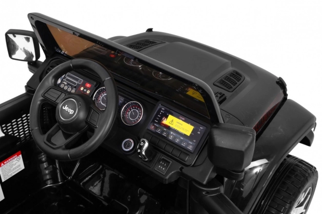 Jeep Wrangler Rubicon baterie pro děti černá + dálkové ovládání + MP3 LED rádio + EVA kola