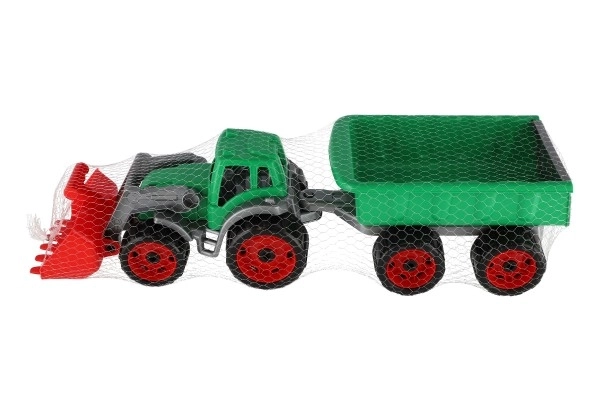 Traktor/nakladač/bagr s vlekem se lžící plast na volný chod 2 barvy v síťce 16x61x16cm