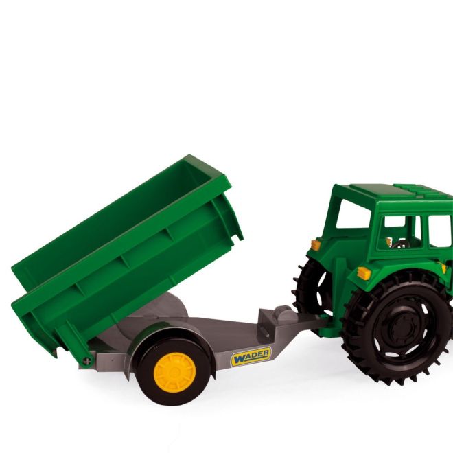 Farmářský traktor s přívěsem v kartonové krabici