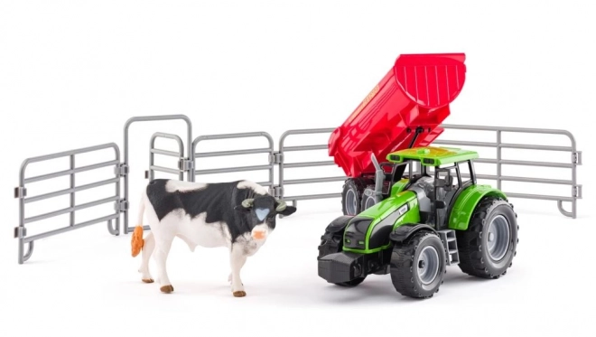 Traktor s přívěsem a býkem se zahradou