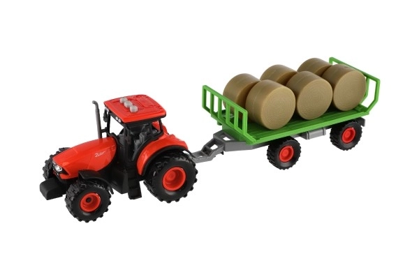 Traktor Zetor s vlekem a balíky plast 36cm na setrvačník na bat. se světlem se zvukem v krab. 39x13