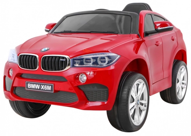 Dětské elektrické autíčko BMW X6M lakované na červeno + dálkové ovládání + EVA + pomalý start + audio + LED dioda