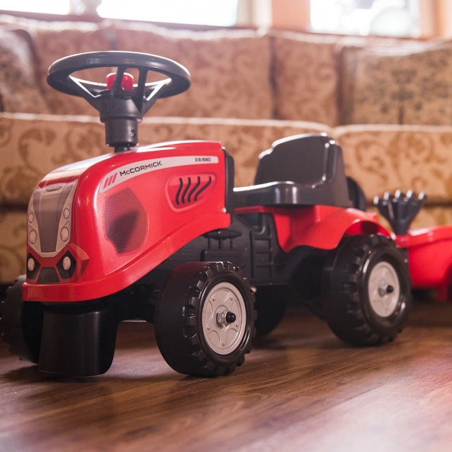 Dětský traktor Baby Mac Cormick červený s přívěsem