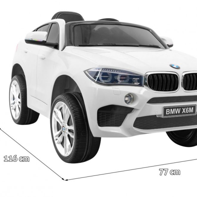 BMW X6M Elektrické dětské auto bílé + dálkové ovládání + EVA + pomalý start + audio panel + LED dioda
