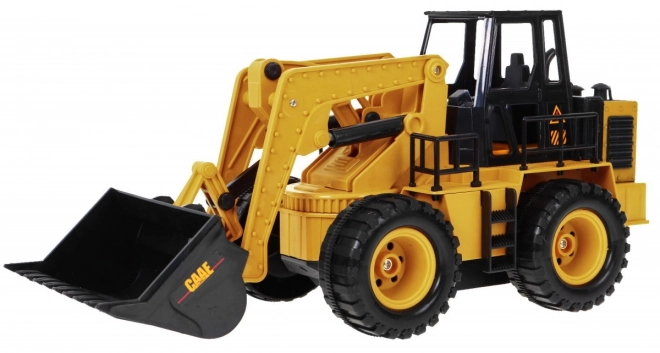 Dálkově ovládaný buldozer pro děti 3+ Model 1:24 Pohyblivý kbelík + zvuky + příslušenství