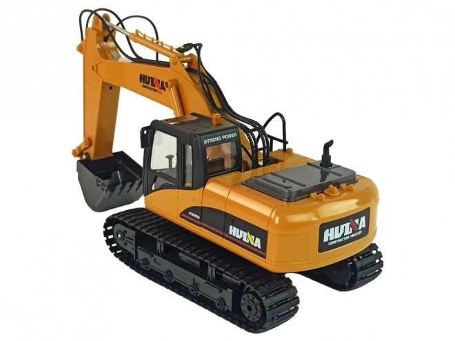 Žlutý RC bagr Caterpillar 1:14 na dálkové ovládání