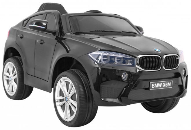 BMW X6M Elektrické dětské auto Lak černá + Dálkové ovládání + EVA + Pomalý start + Audio + LED