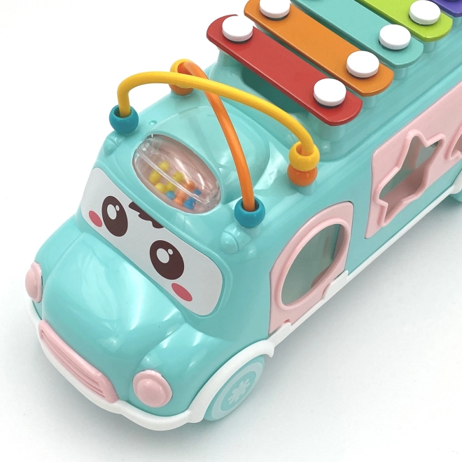 Woopie růžové hudební auto s třídicími prvky a činely