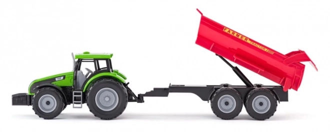 Traktor s přívěsem a býkem se zahradou