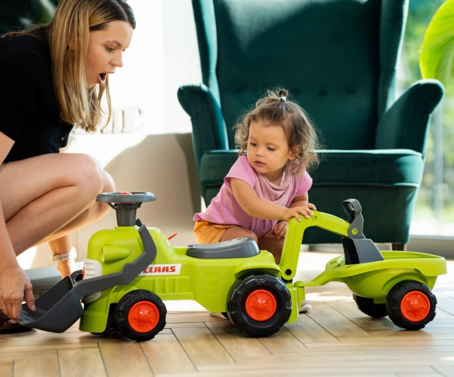 Jezdicí traktor Claas s přívěsem, nakladačem a lžící