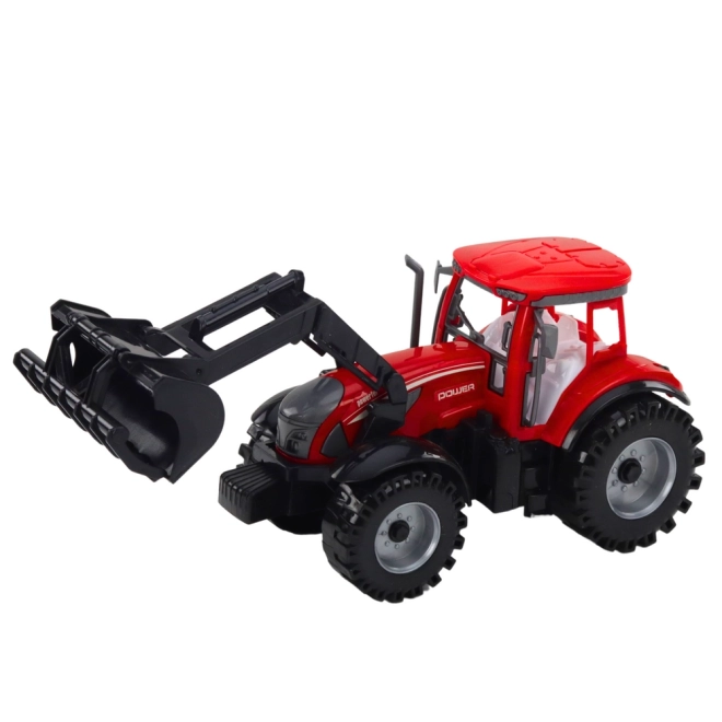 Červený traktor s nakladačem a balíkovačem