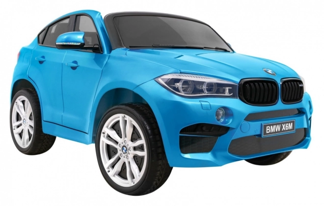 BMW X6M XXL pro 2 děti Modrá barva + Pilot + Eco kůže + Bezpečnostní pásy + Pomalý start + MP3 + LED