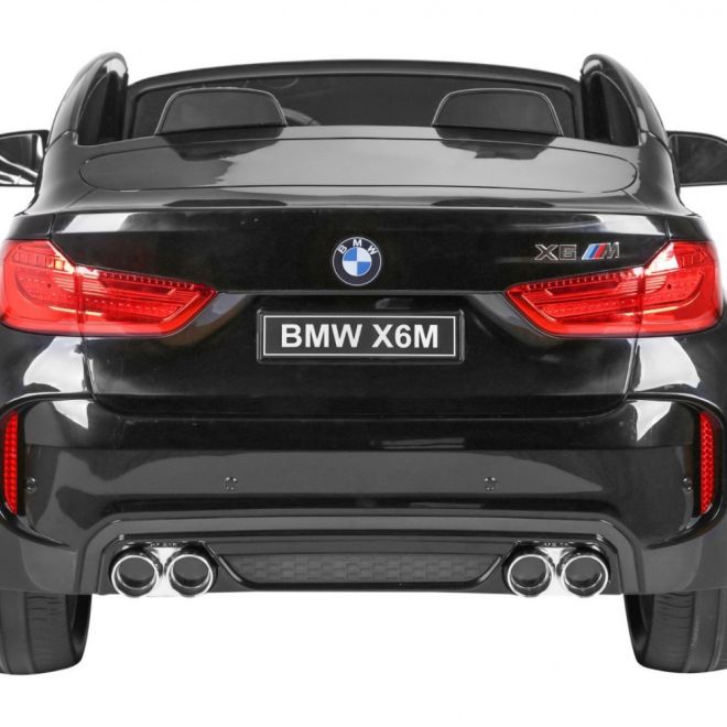 BMW X6M XXL pro 2 děti Černá + Dálkové ovládání + Eko kůže + Bezpečnostní pásy + Pomalý rozjezd + MP3 USB + LED dioda