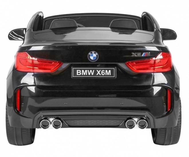 BMW X6M XXL pro 2 děti Černá + Dálkové ovládání + Eko kůže + Bezpečnostní pásy + Pomalý rozjezd + MP3 USB + LED dioda