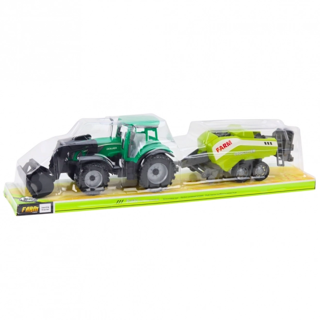 Zelený traktor s nakladačem a kompatibilním lisem na balíky