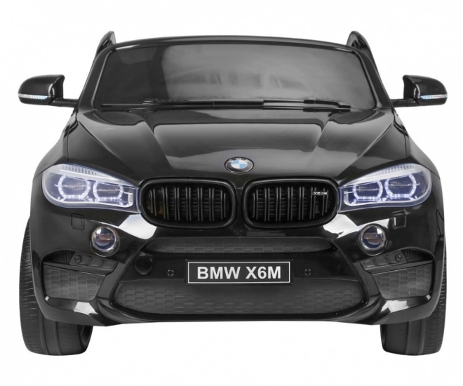 BMW X6M XXL pro 2 děti Černá + Dálkové ovládání + Eko kůže + Bezpečnostní pásy + Pomalý rozjezd + MP3 USB + LED dioda