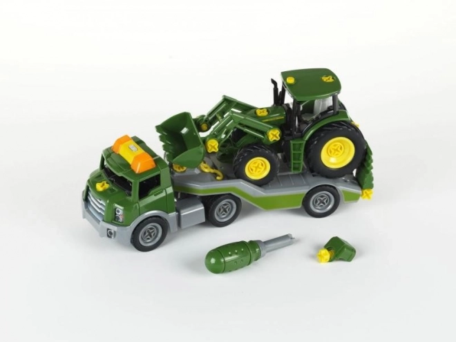 Otočný traktor John Deere na přívěsu