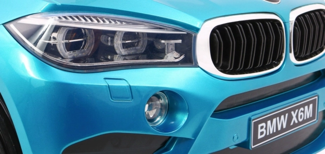 BMW X6M Elektrické dětské auto Modrá barva + dálkové ovládání + EVA + pomalý start + audio + LED dioda