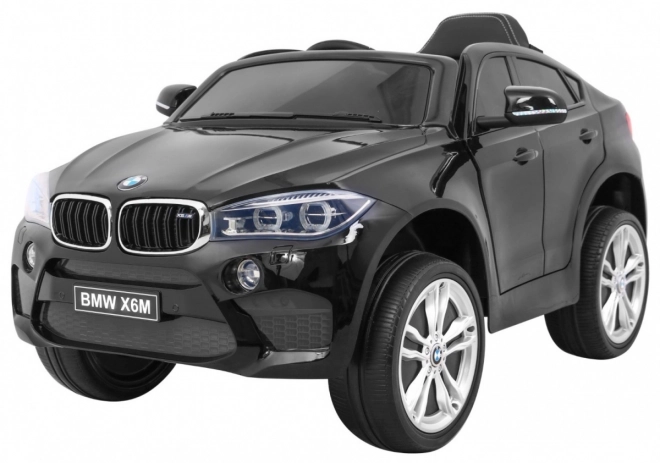 BMW X6M Elektrické dětské auto Lak černá + Dálkové ovládání + EVA + Pomalý start + Audio + LED