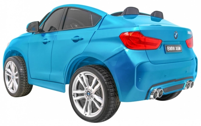 BMW X6M XXL pro 2 děti Modrá barva + Pilot + Eco kůže + Bezpečnostní pásy + Pomalý start + MP3 + LED