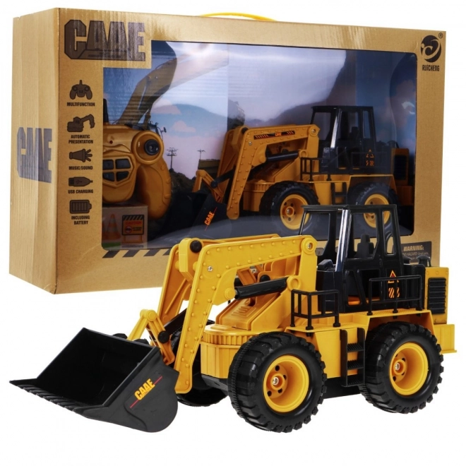 Dálkově ovládaný buldozer pro děti 3+ Model 1:24 Pohyblivý kbelík + zvuky + příslušenství